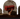 A hand emerging from a grave, holding the Obituary game box